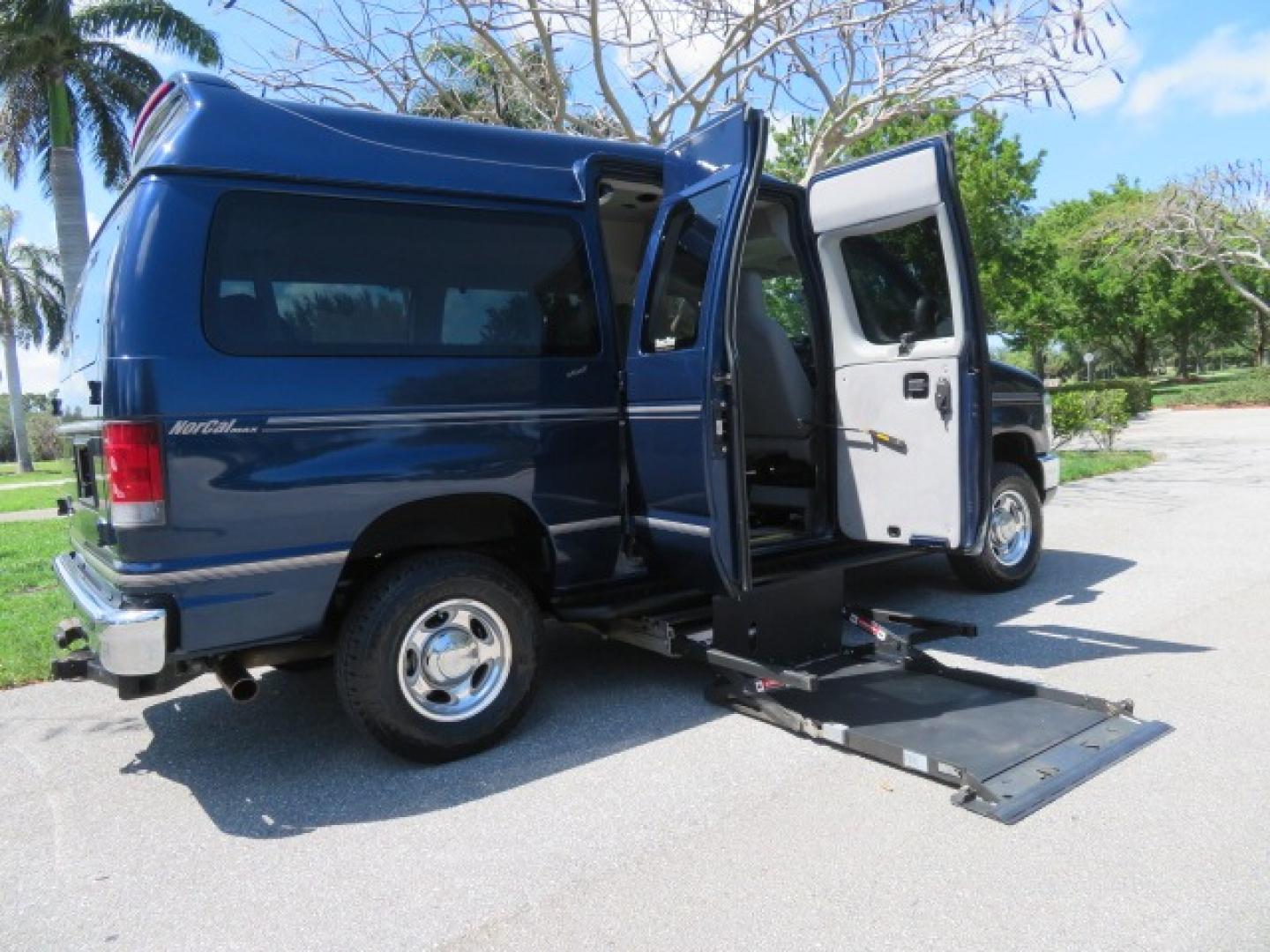 2011 Dark Blue /Gray Ford E-Series Wagon E-350 XLT Super Duty (1FBNE3BS4BD) with an 6.8L V10 SOHC 20V engine, located at 4301 Oak Circle #19, Boca Raton, FL, 33431, (954) 561-2499, 26.388861, -80.084038 - You are looking at a Gorgeous 2011 Ford Econoline E350 XLT Norcal Max High Top Handicap Wheelchair Conversion Van with 6.8L V10, 15K Original Miles, 9 Inch Lowered Floor, Braun UVL Side Entry Wheelchair Lift, Remote Control Power Side Entry Doors, Expanded Side Entry Doors, Q Straint Tie Down, Syste - Photo#49